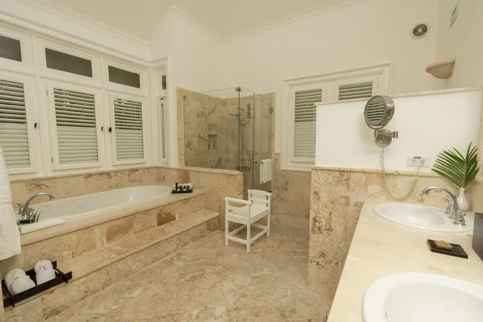 Ocean View Two Bedrooms Suite bathroom with tub, shower, and vanity at Tortuga Bay Hotel.