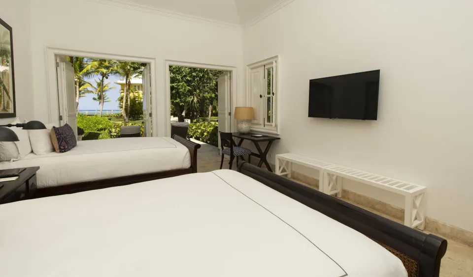 Ocean View Two Bedrooms Suite bedroom with two beds and garden-ocean view at Tortuga Bay Hotel.