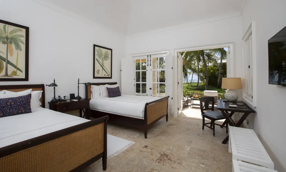 Ocean View Two Bedrooms Suite with two beds and patio at Tortuga Bay Hotel.