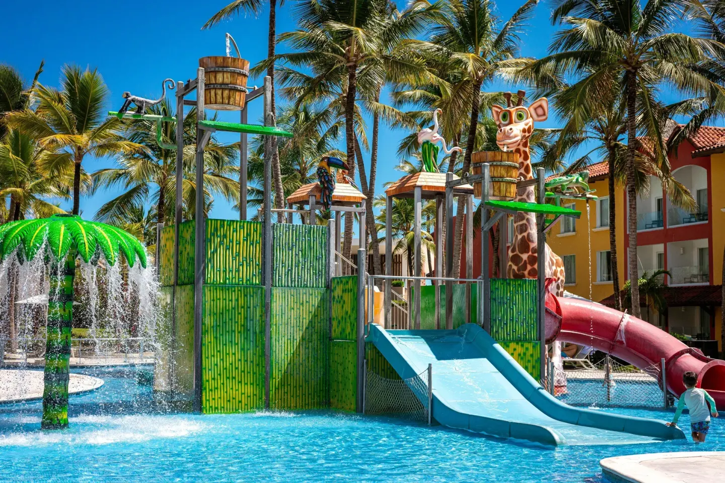Children's splash pool with slides and animal figures at Tropical Deluxe Princess.