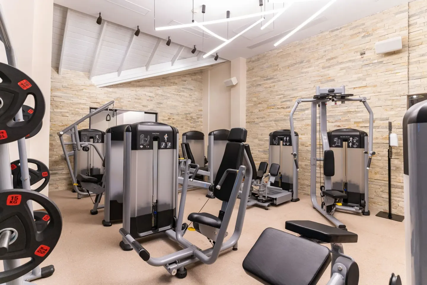 Fitness room with weight machines and benches at Tropical Deluxe Princess.