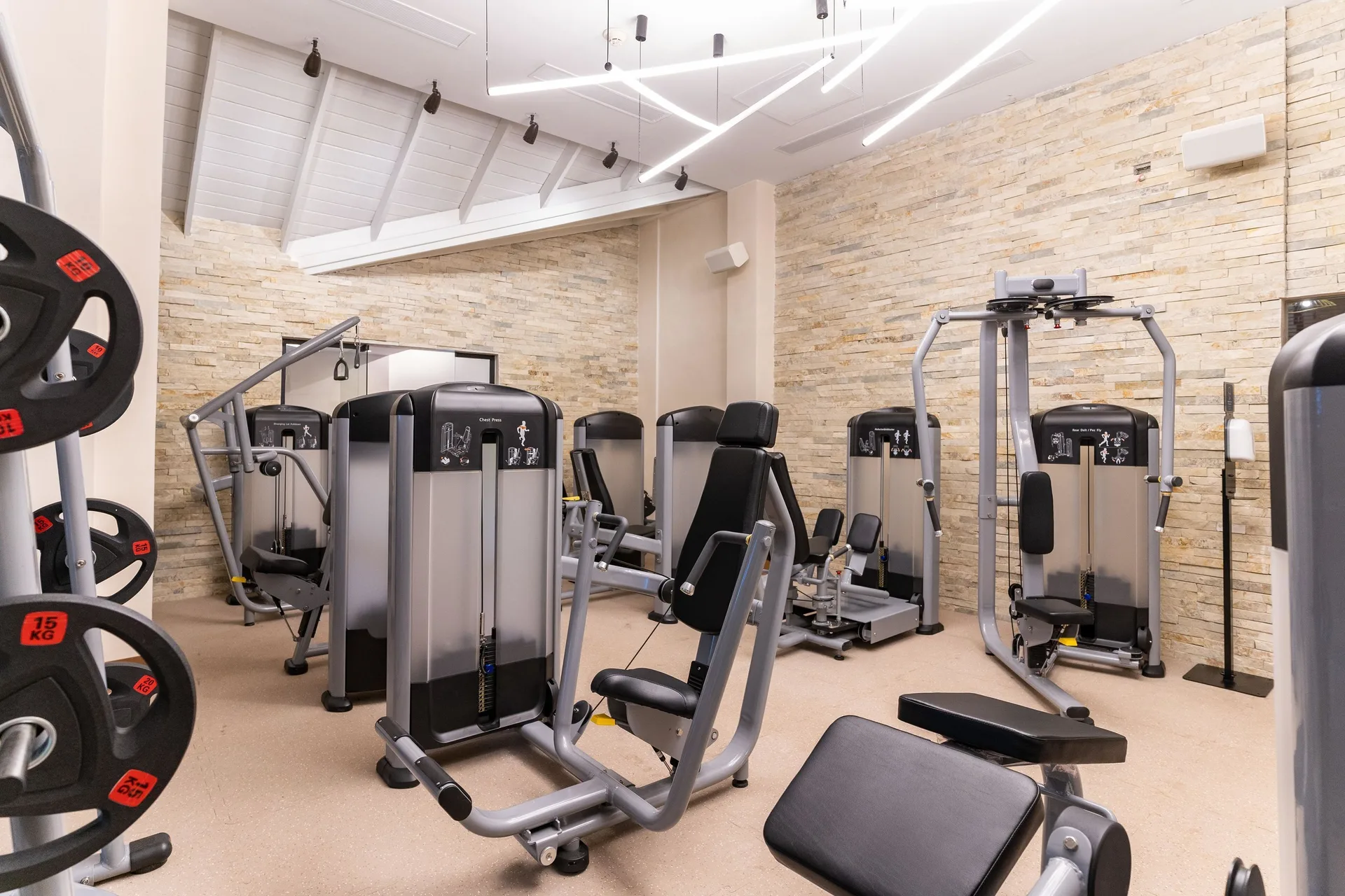 Fitness room with weight machines and benches at Tropical Deluxe Princess.