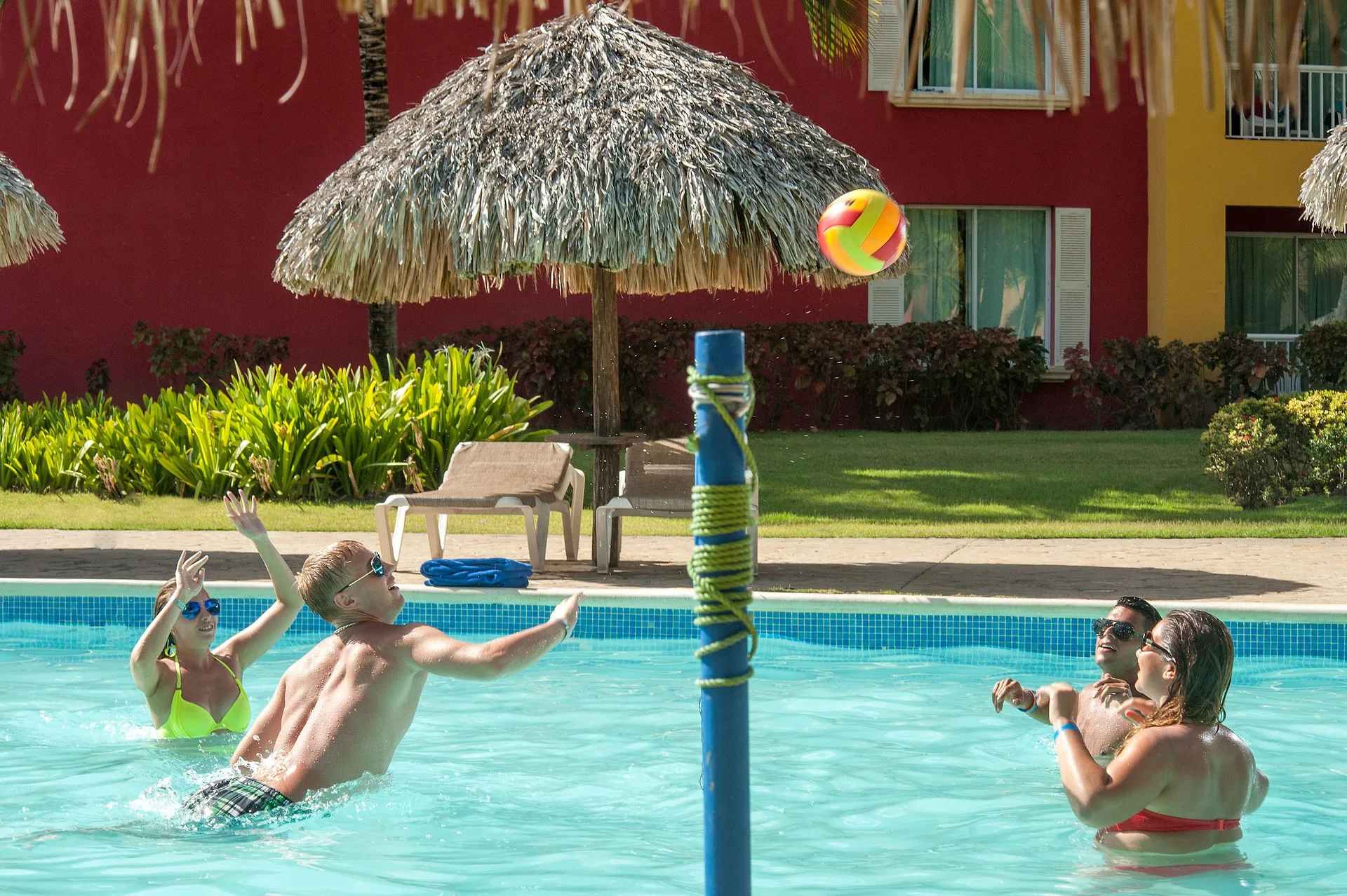 Guests playing pool volleyball at Tropical Deluxe Princess.