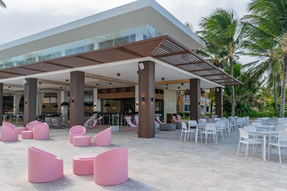 Open-air bar terrace with lounge chairs and tables at Tropical Deluxe Princess.