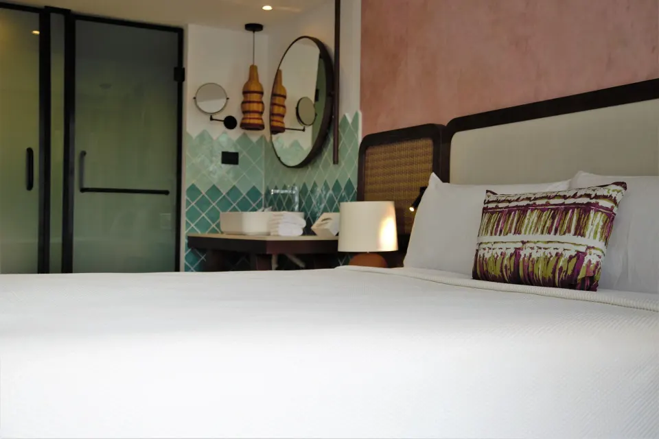 Family Room king bed and open vanity area at Tropical Deluxe Princess.