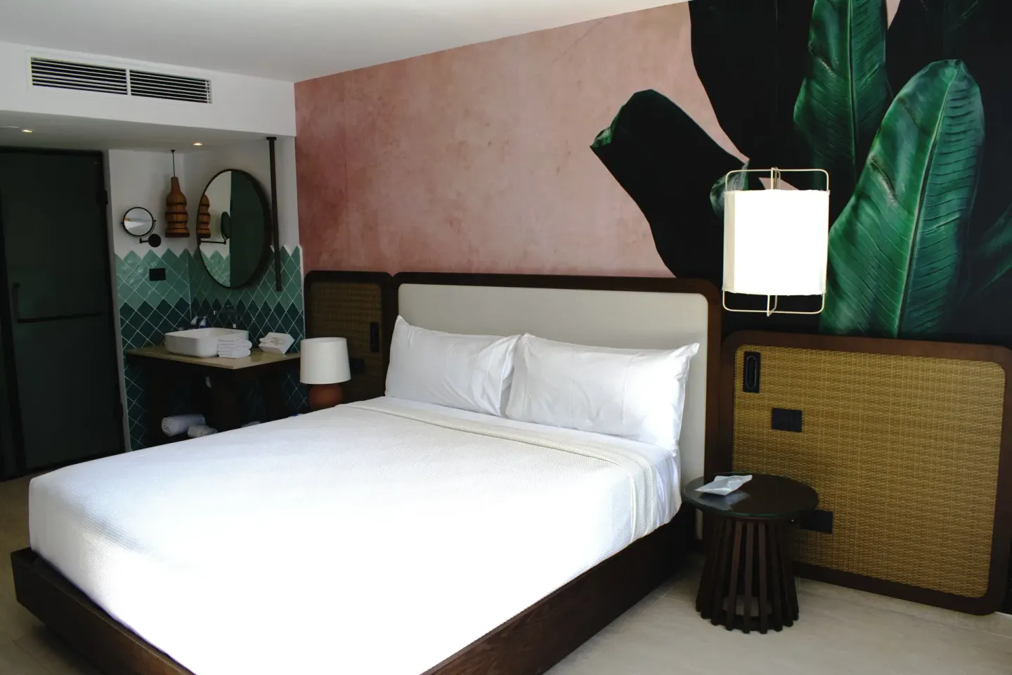 Family Room king bed with tropical wall mural at Tropical Deluxe Princess.
