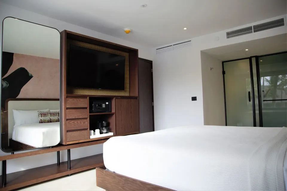 Family Room bed, mirror, TV cabinet and glass shower at Tropical Deluxe Princess.