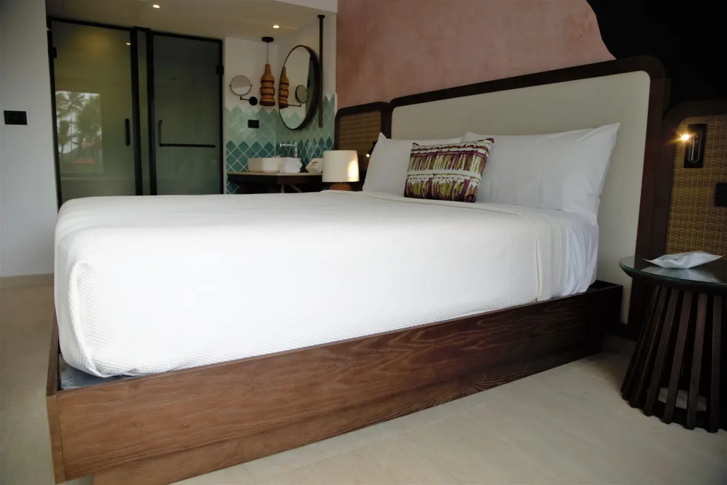 Family Room platform king bed and bedside table at Tropical Deluxe Princess.