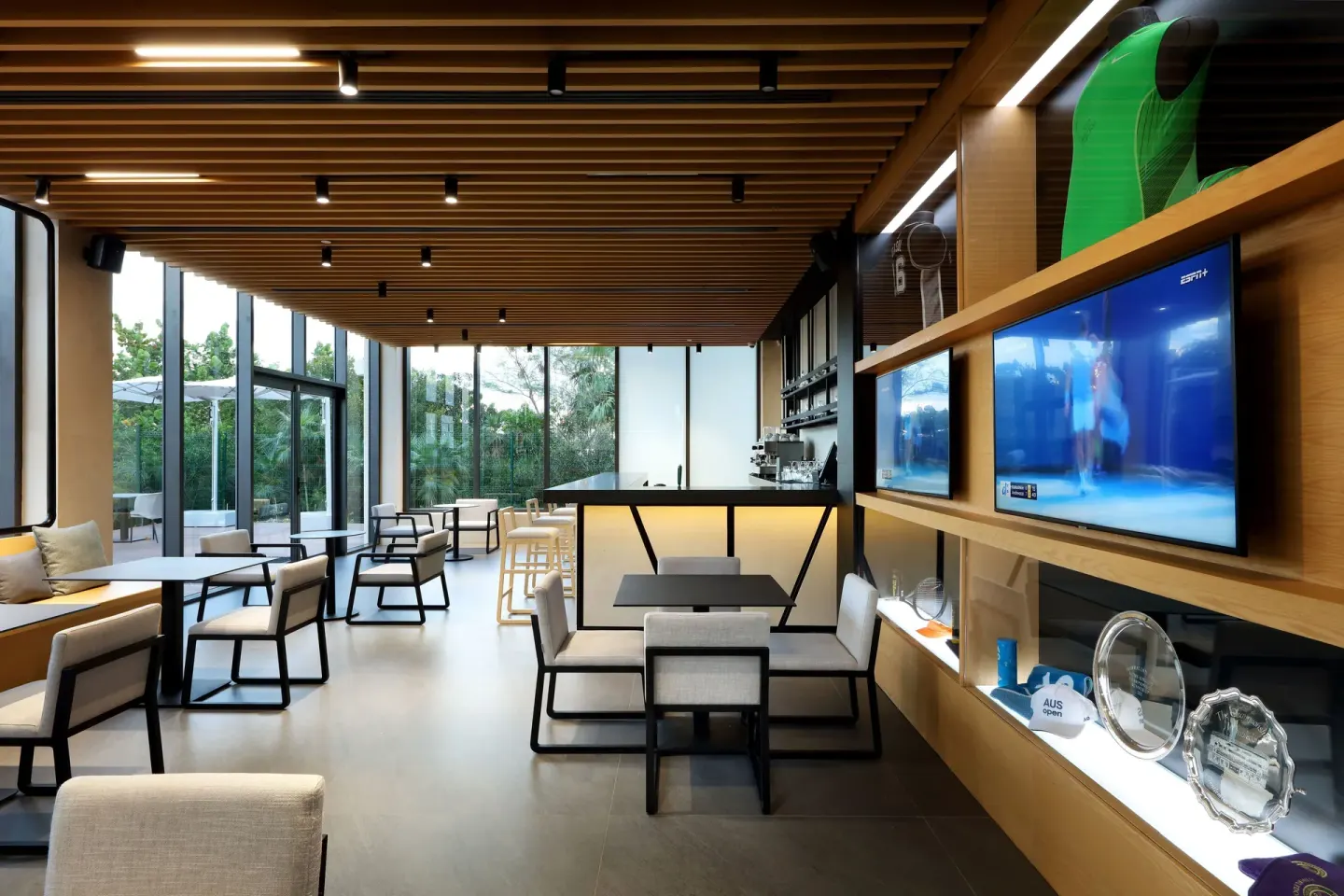 Sports bar lounge with TVs and seating at TRS Coral Hotel.