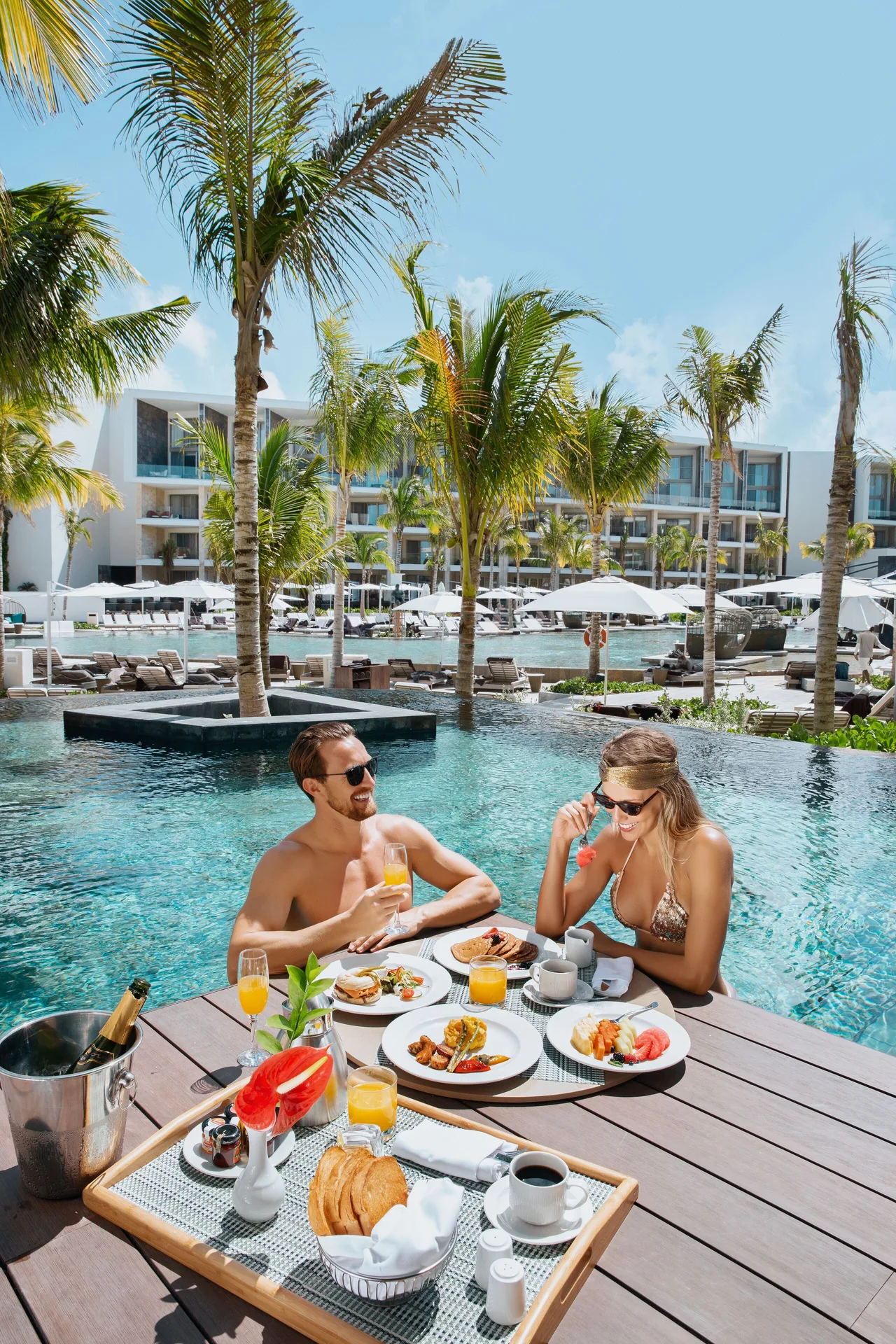 Guests enjoy breakfast on a swim-out terrace by the pool at TRS Coral Hotel.