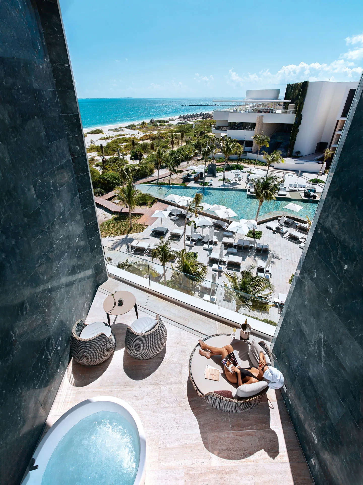 Loft Suite Jacuzzi terrace with ocean and pool views at TRS Coral Hotel.