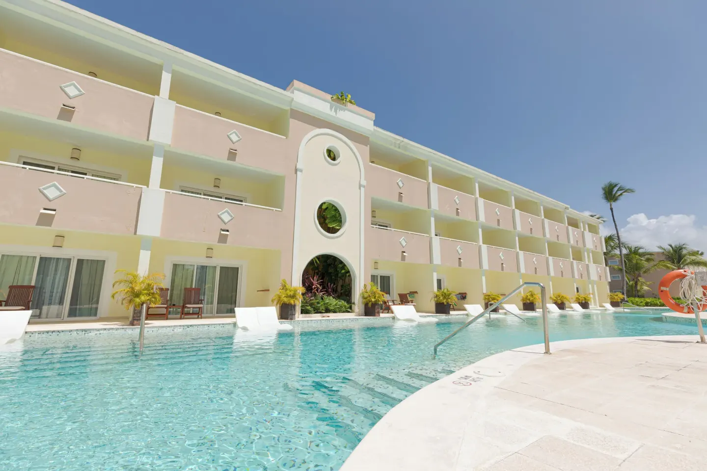 Swim-up pool beside guestroom balconies at TRS Turquesa Hotel.