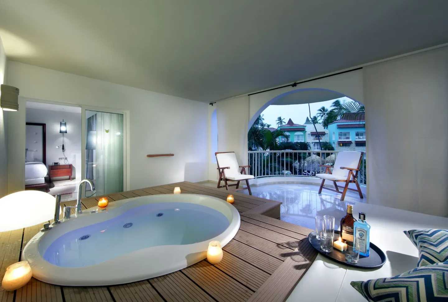 Terrace whirlpool with daybed and balcony chairs at TRS Turquesa Hotel.