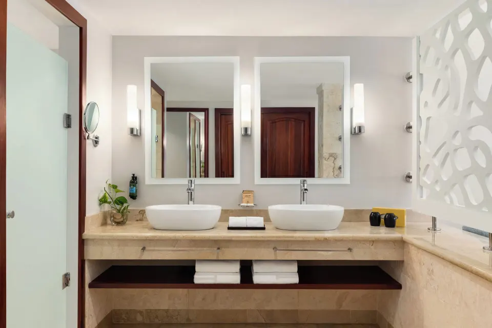 Jacuzzi Terrace Suite Beachside bathroom with double vessel sinks at TRS Turquesa Hotel.