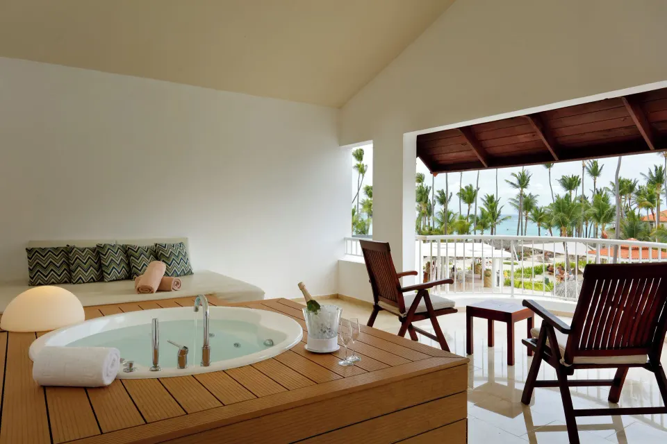 Jacuzzi Terrace Suite Beachside terrace with whirlpool and ocean view at TRS Turquesa Hotel.