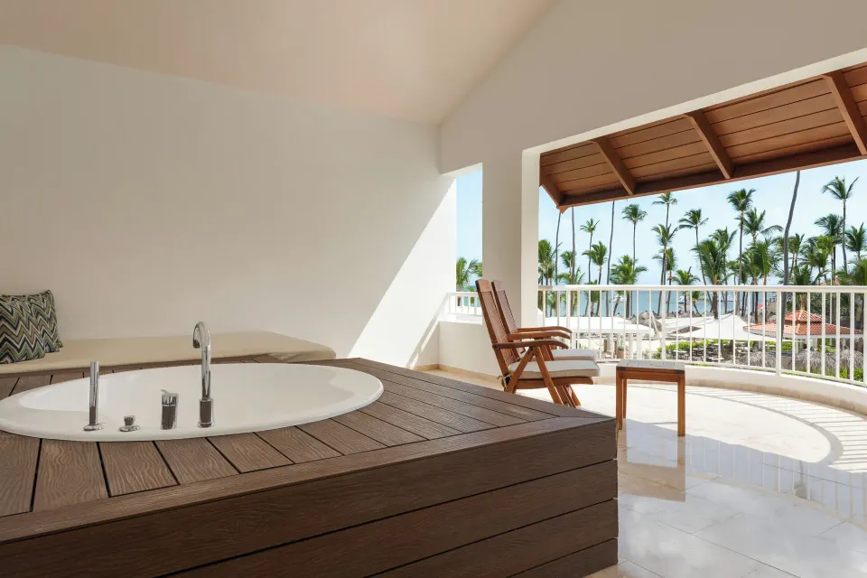 Jacuzzi Terrace Suite Beachside terrace whirlpool with palm view at TRS Turquesa Hotel.