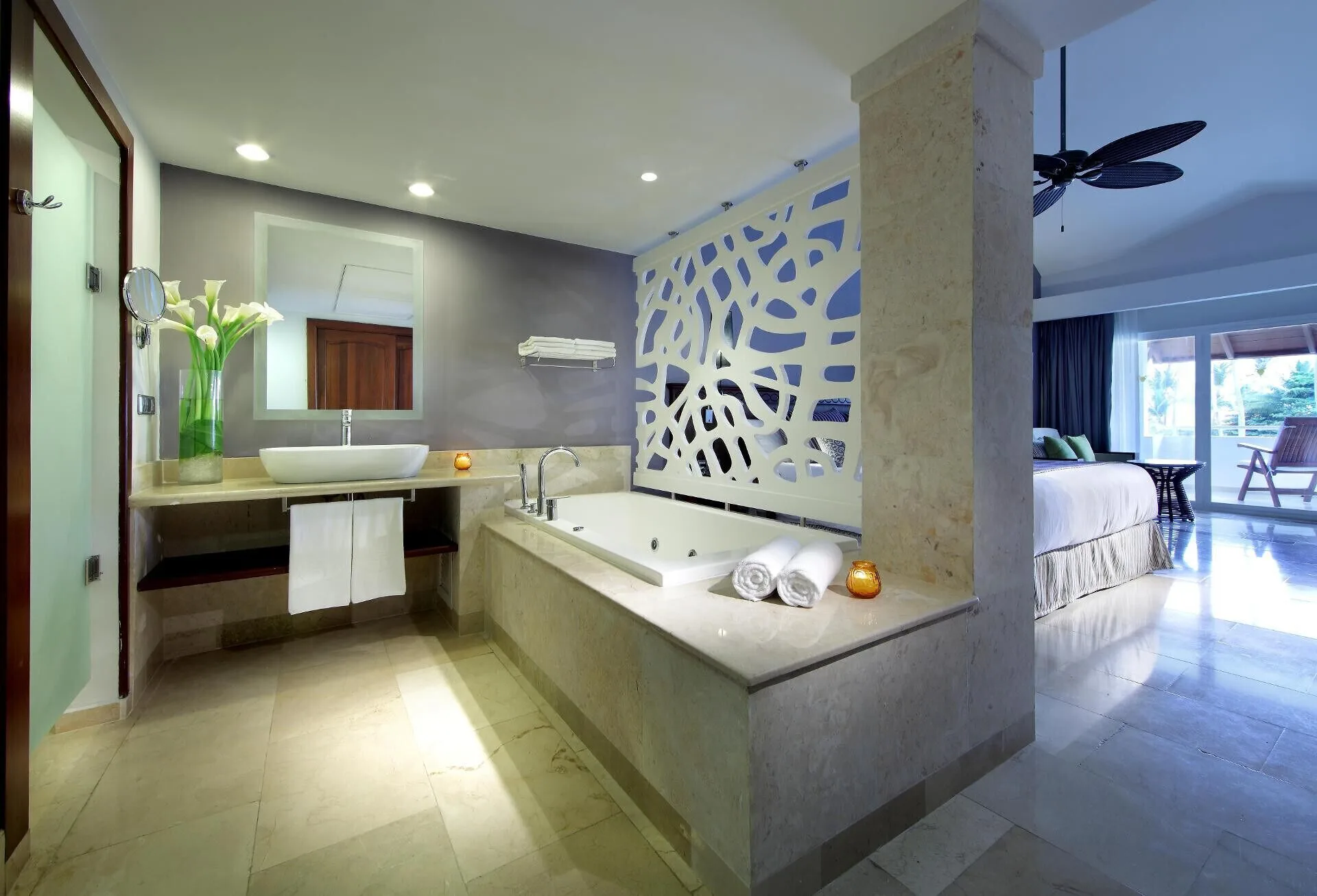 Junior Suite Garden Pool View bathroom with soaking tub and vanity at TRS Turquesa Hotel.