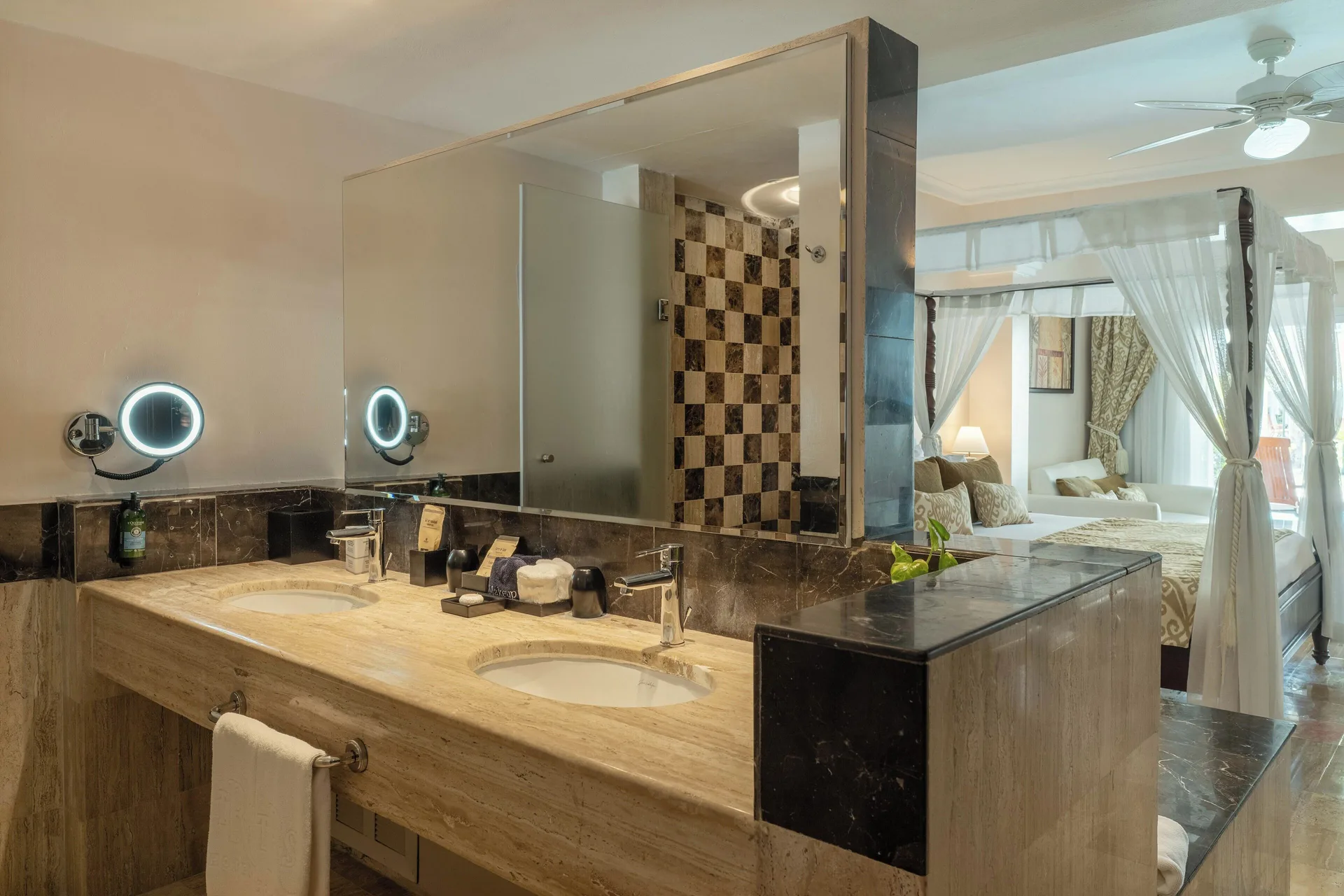 Junior Suite Garden Pool View bathroom vanity and shower at TRS Turquesa Hotel.