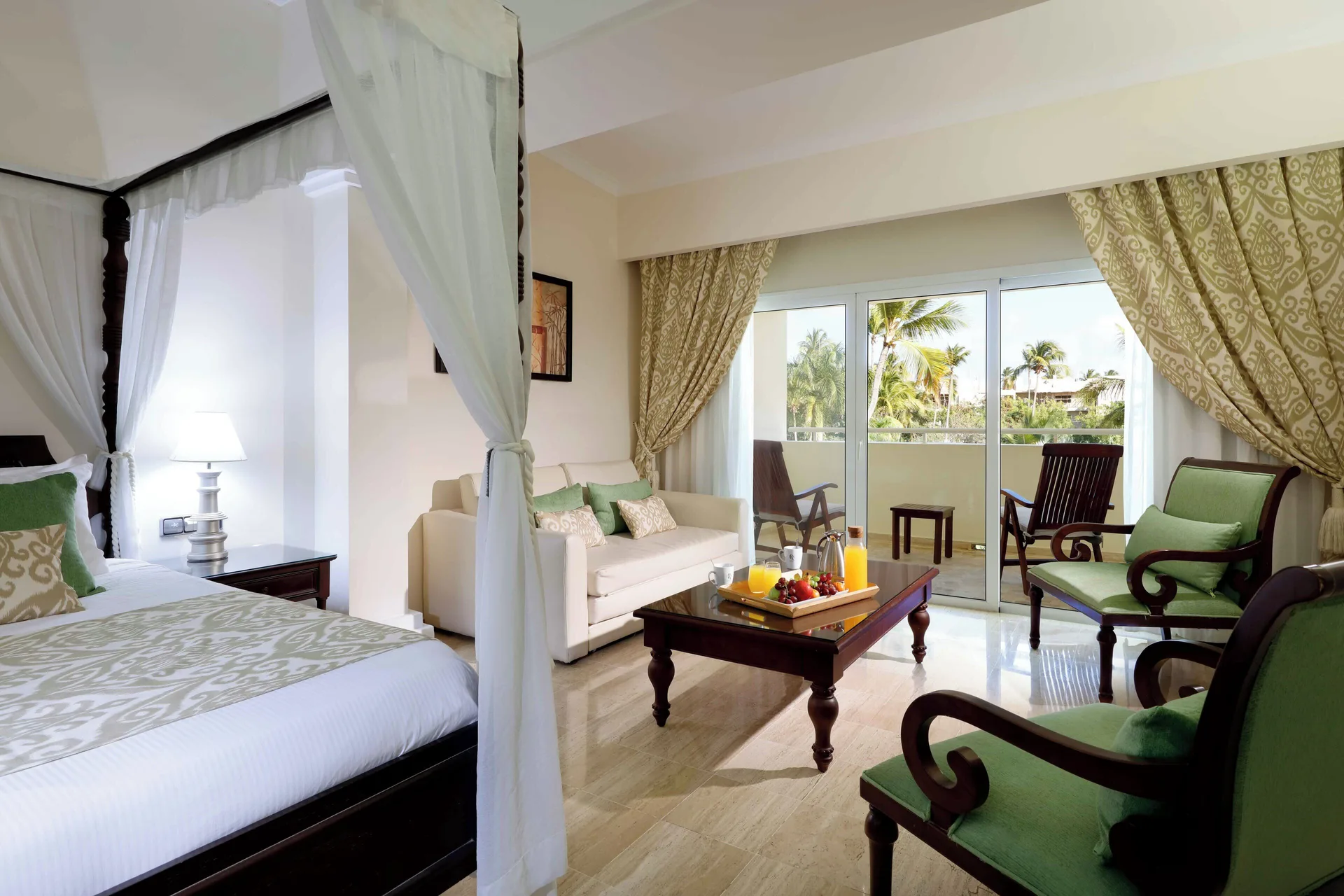 Junior Suite Garden Pool View sitting area with balcony and bed at TRS Turquesa Hotel.