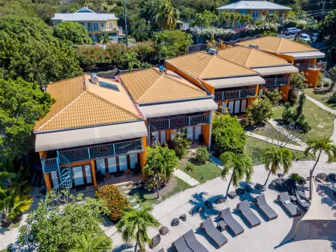 Aerial view of True Blue Bay Resort buildings and garden paths at True Blue Bay Resort.