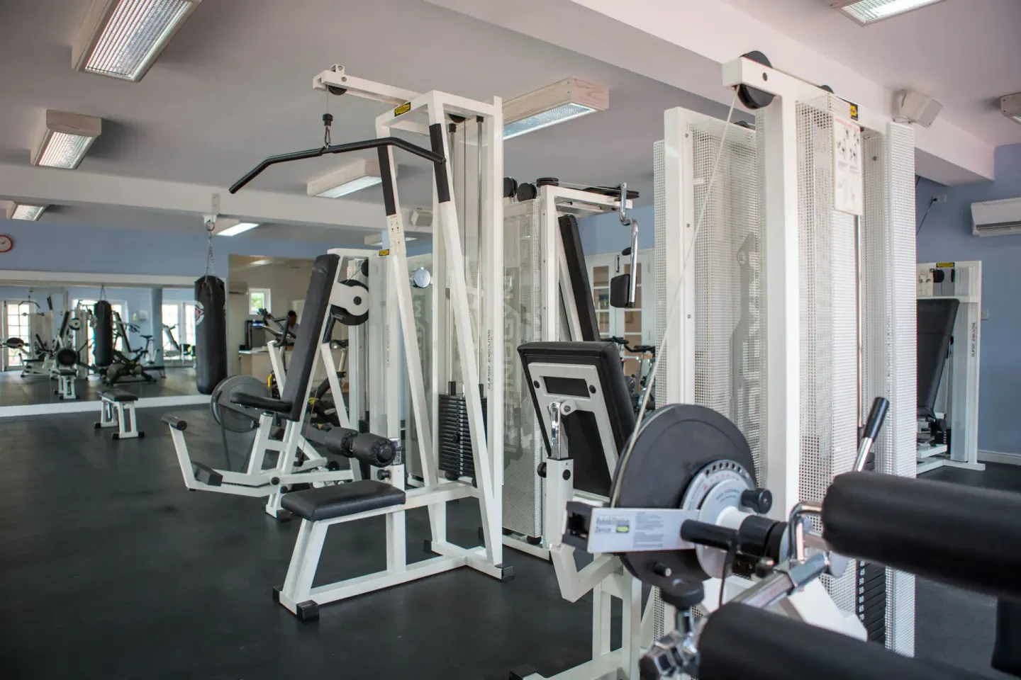 Fitness room weight machines and mirrors inside Turtle Beach.