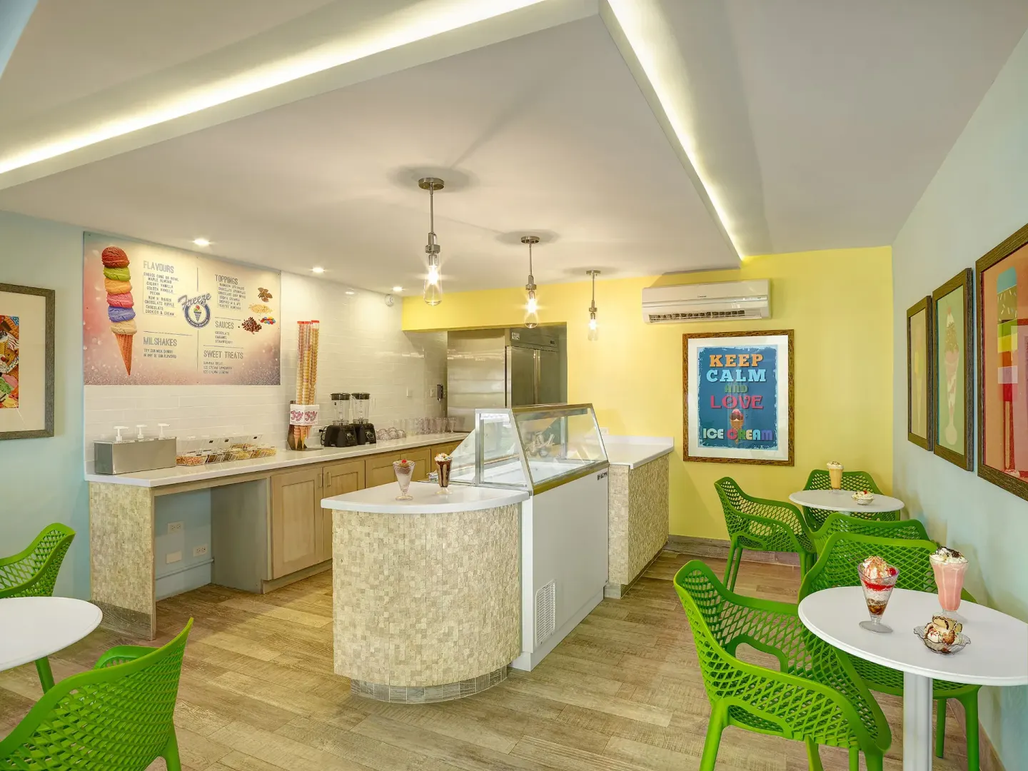 Ice cream shop with green chairs and dessert displays at Turtle Beach.