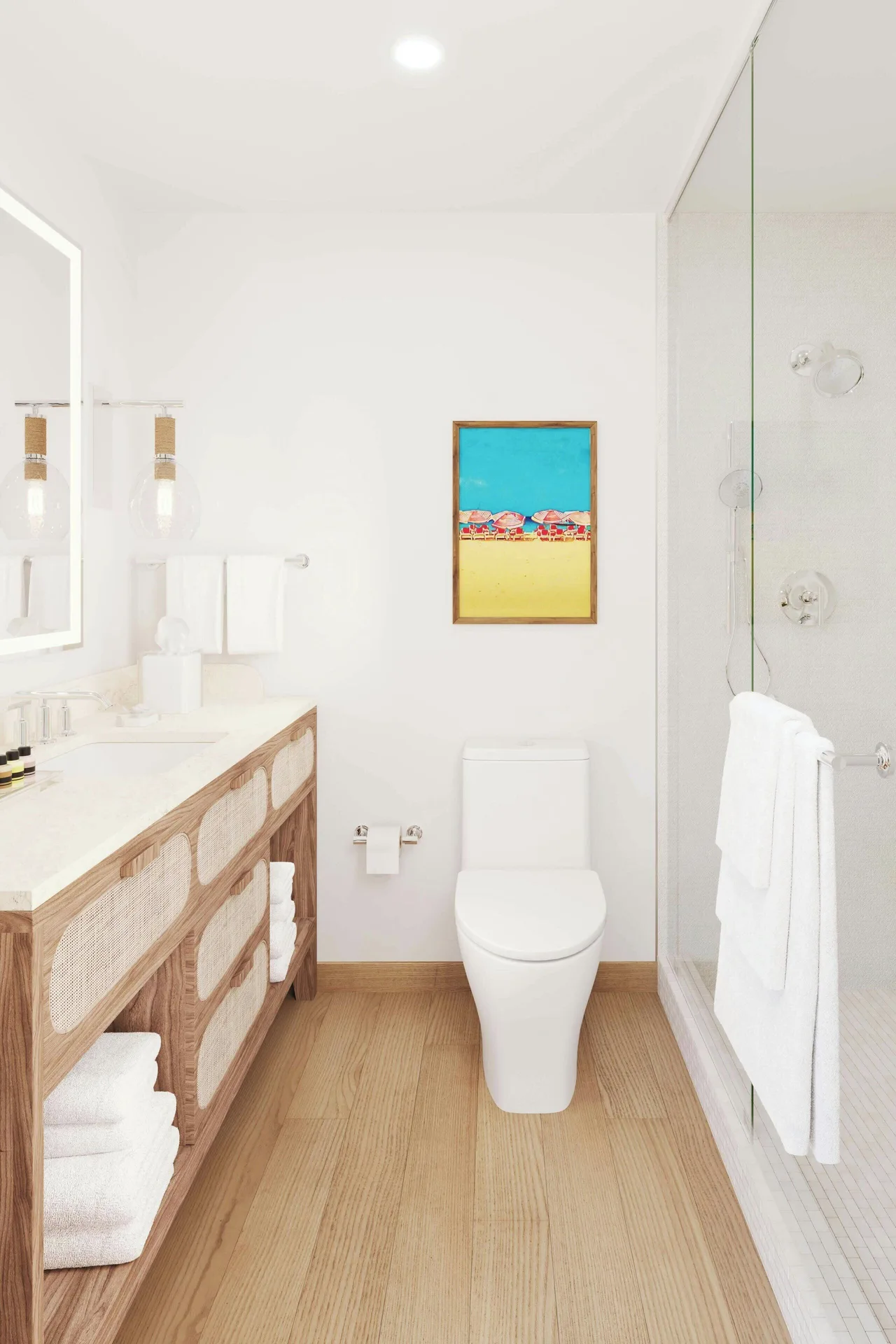 Bright bathroom with vanity, toilet, and glass shower in a suite at Turtle Beach.
