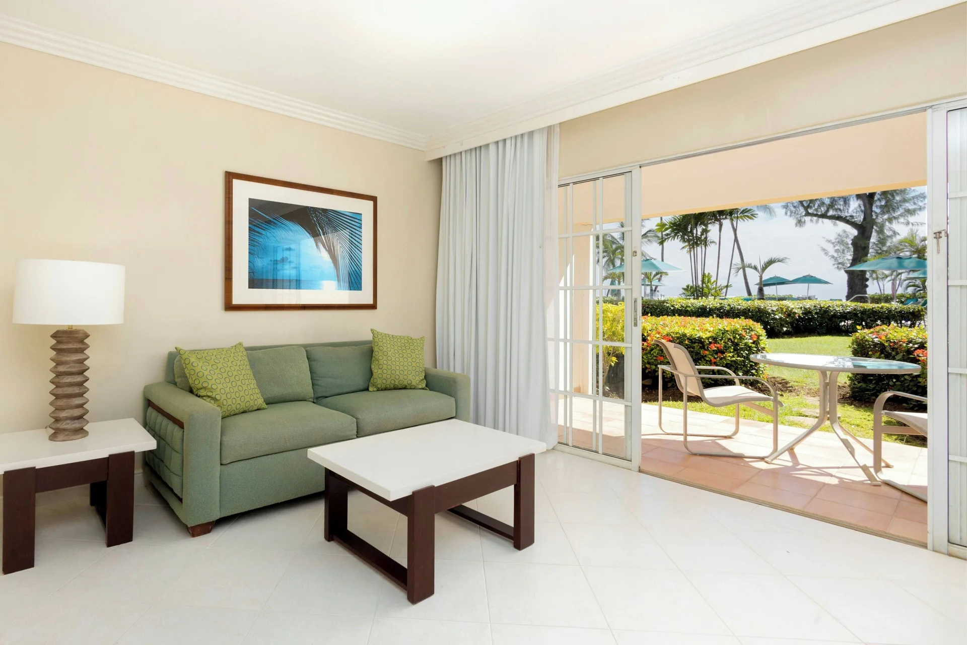 One-Bedroom Suite Pool/garden View at Turtle Beach with sofa bed and tropical garden views in Barbados.