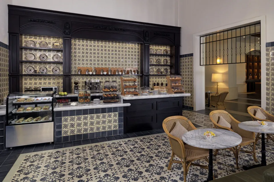 Bright pastry counter and seating area in the café at Unico Hotel Riviera Maya