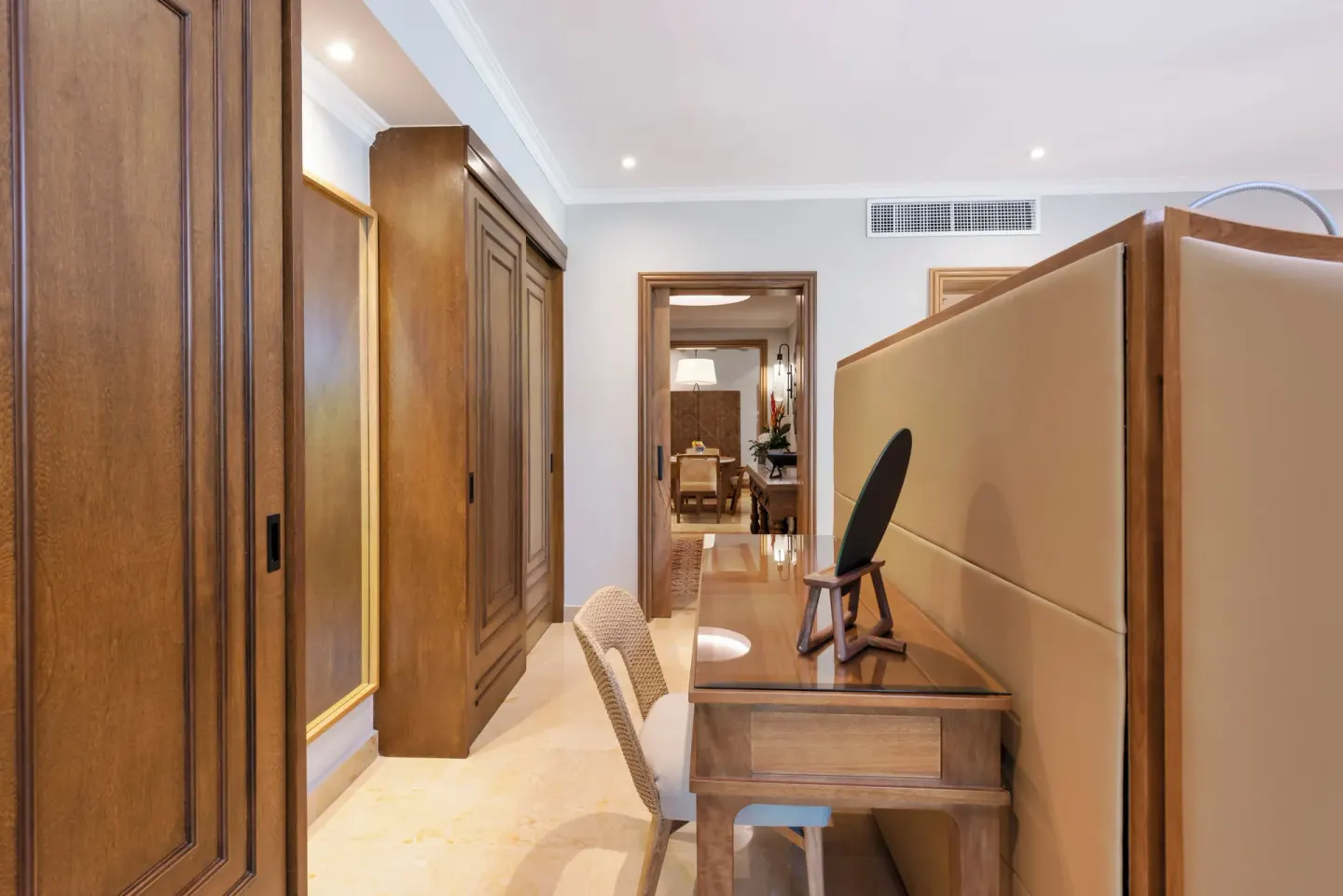 Guest suite desk and wardrobe corridor at Valentin Imperial Riviera Maya.