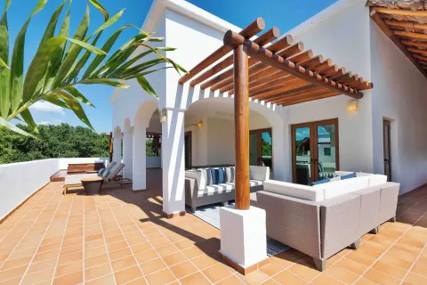 Large terrace with sofas and loungers at Valentin Imperial Riviera Maya.