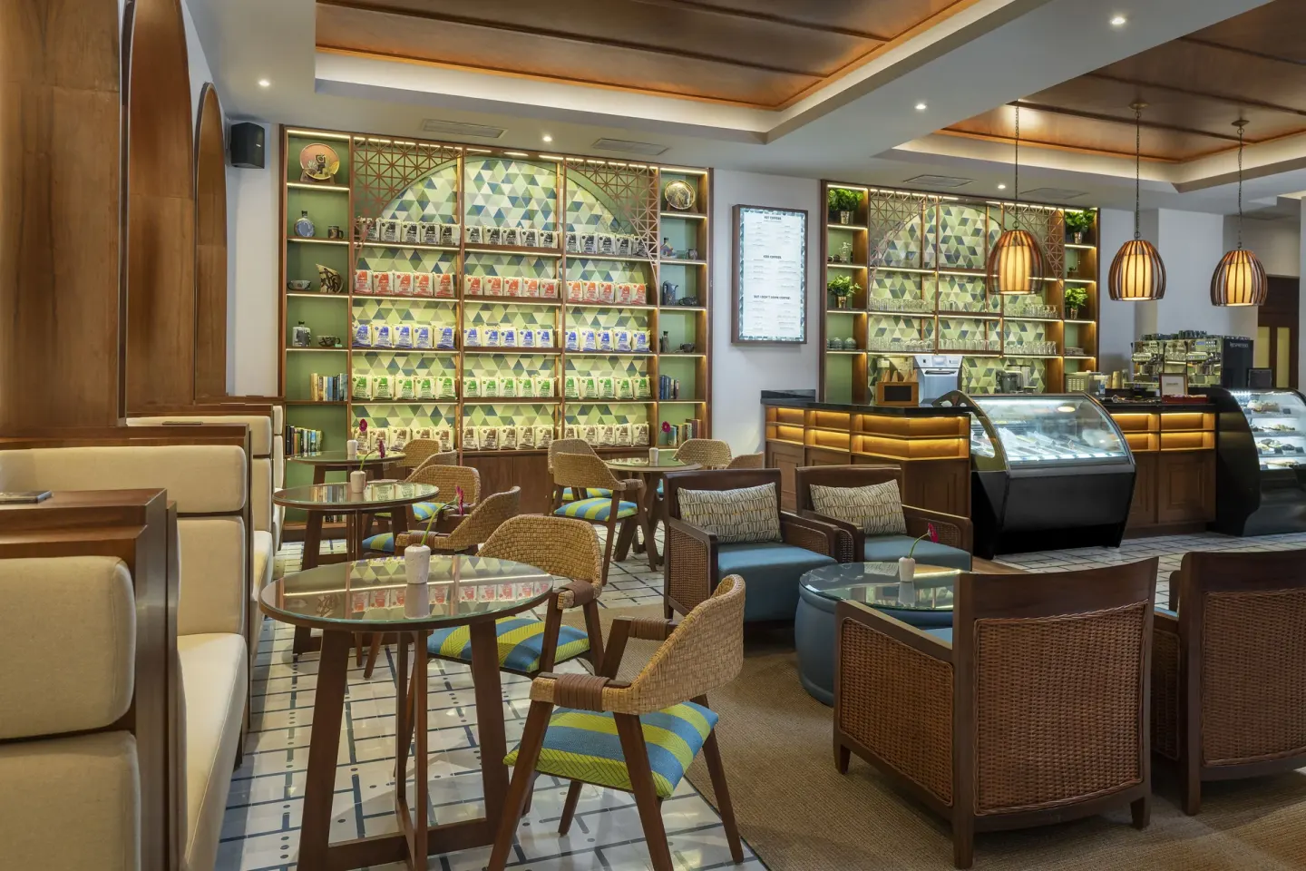 Café seating and pastry cases inside Café Sisal at Valentin Imperial Riviera Maya.