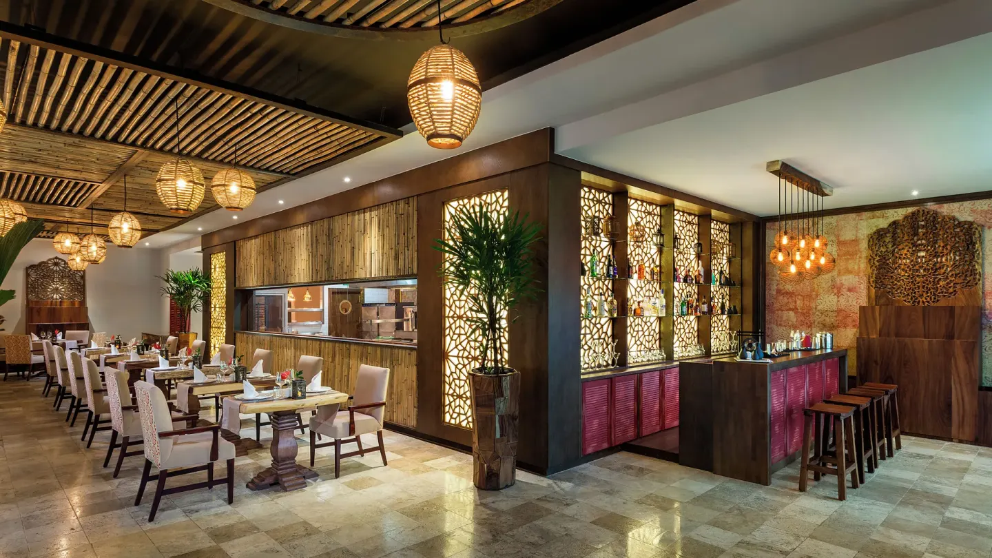 Restaurant dining room and bar with open kitchen at Valentin Imperial Riviera Maya.