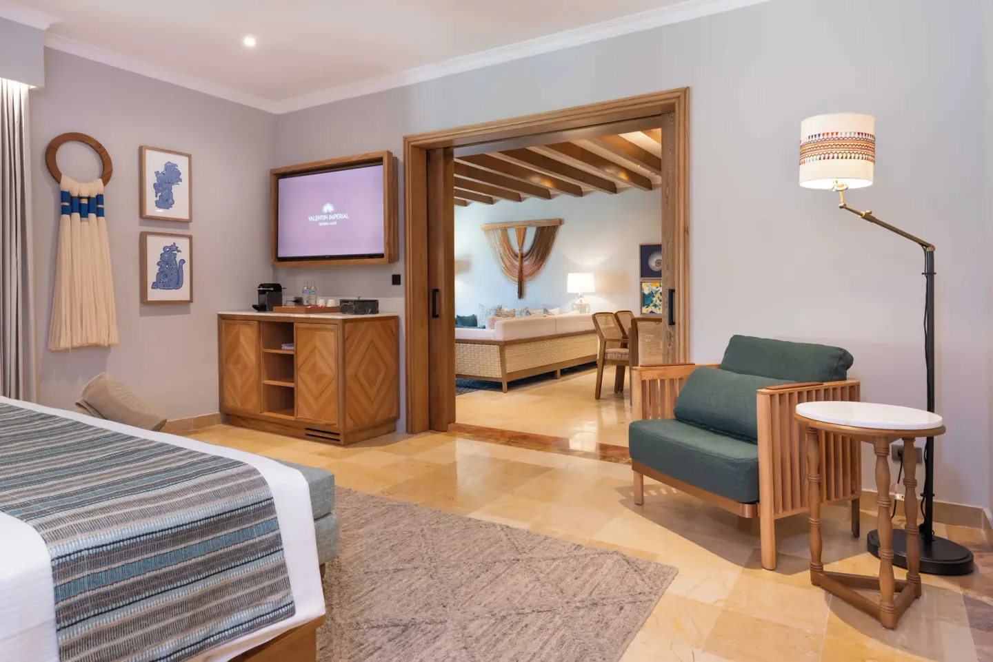Diamond Suite bedroom seating and living room doorway at Valentin Imperial Riviera Maya.