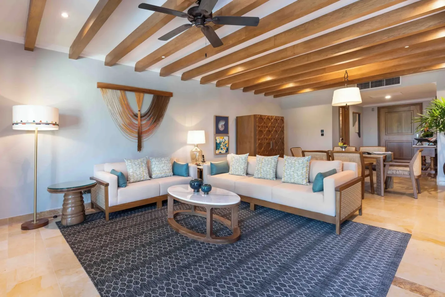 Diamond Suite lounge with sofas and dining area at Valentin Imperial Riviera Maya.