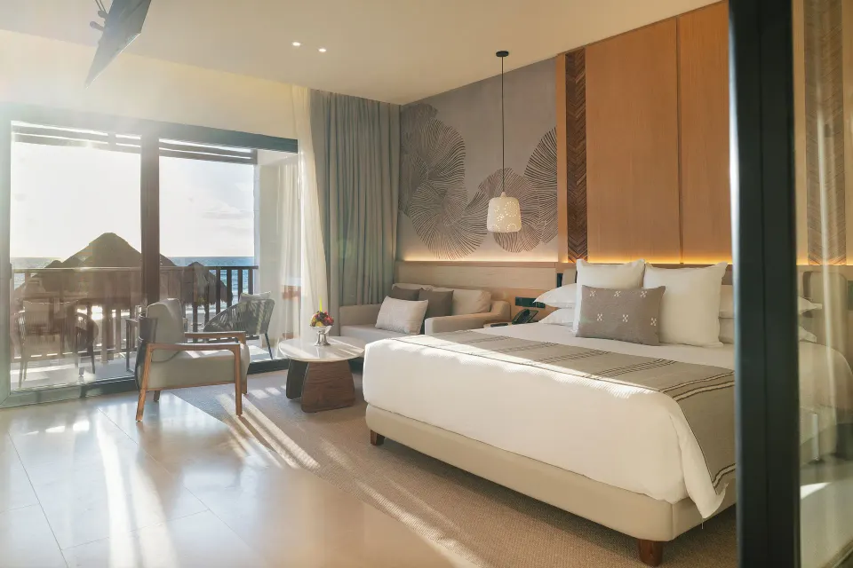 Dunas Private Pool Ocean View Suite king bed and balcony view at Valentin Imperial Riviera Maya.