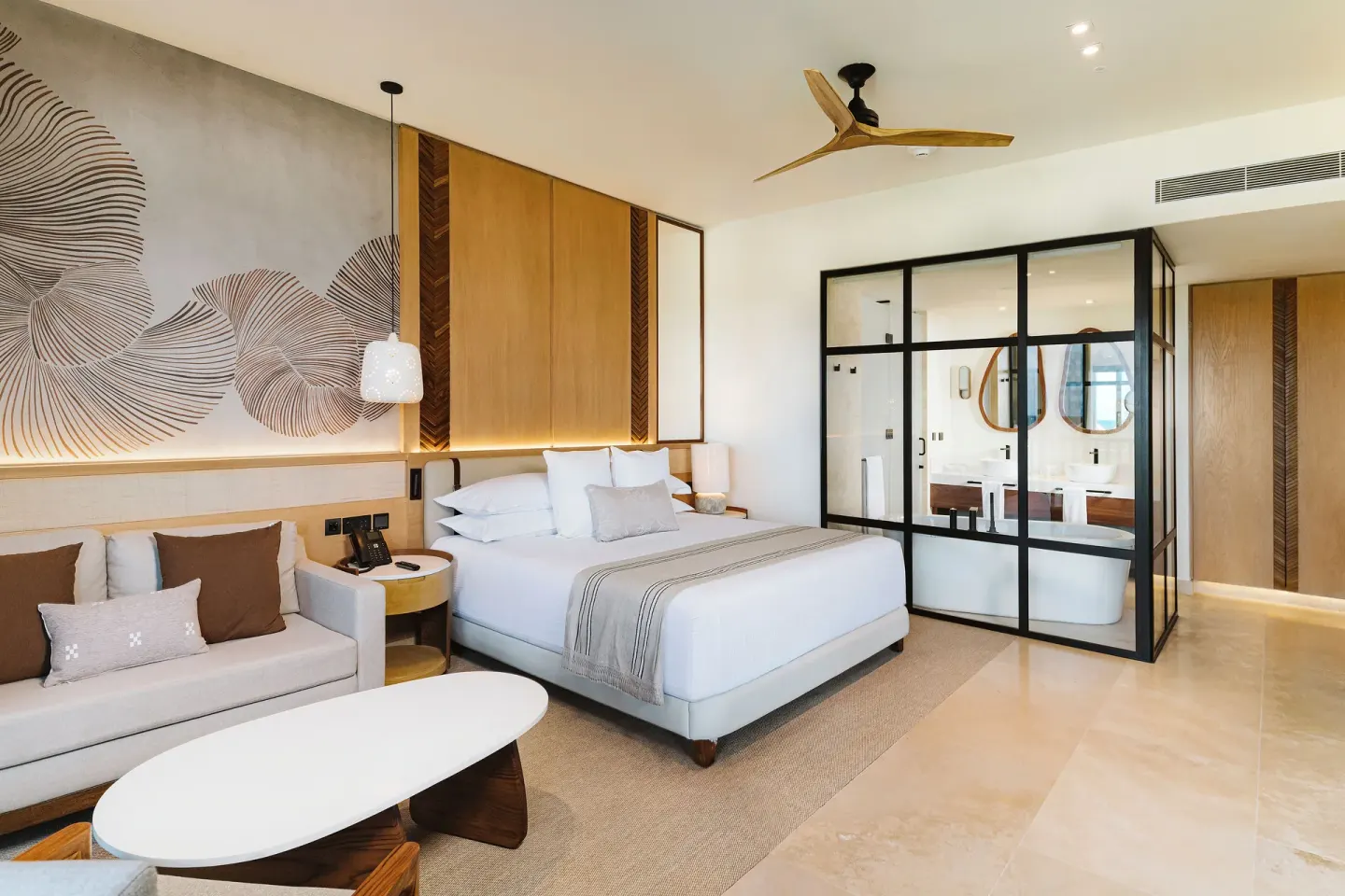Dunas Private Pool Ocean View Suite bed and glass bathroom at Valentin Imperial Riviera Maya.