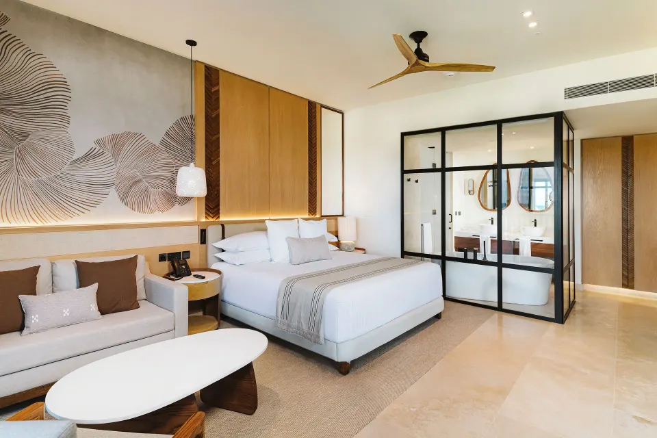 Dunas Private Pool Ocean View Suite bed and glass bathroom at Valentin Imperial Riviera Maya.