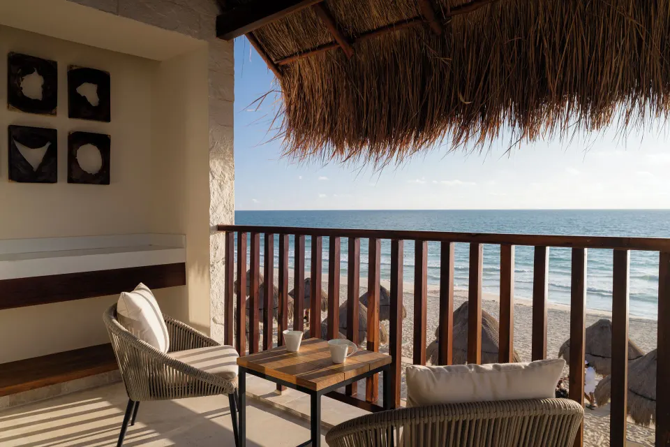 Dunas suite ocean-view balcony with seating at Valentin Imperial Riviera Maya.