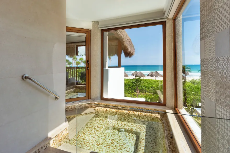 Emerald Junior Suite indoor jetted tub with ocean view at Valentin Imperial Riviera Maya.