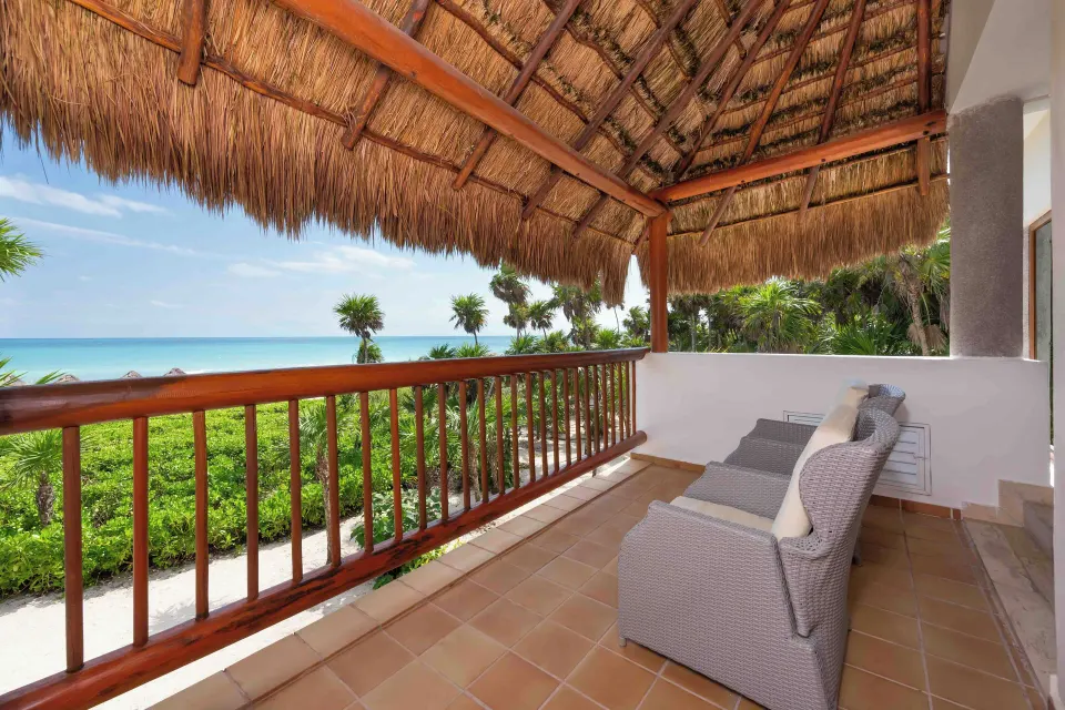 Emerald Junior Suite thatched terrace with ocean view at Valentin Imperial Riviera Maya.