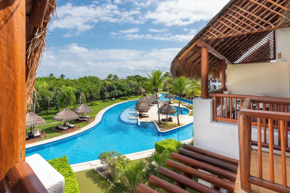 Golden Junior Suite terrace view of pool and gardens at Valentin Imperial Riviera Maya.