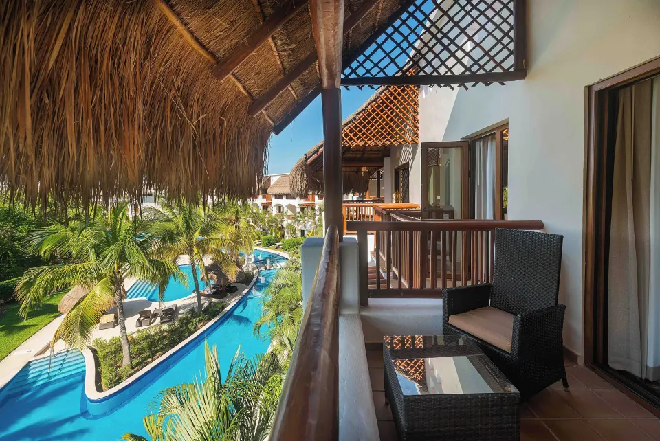 Golden Superior Junior Suite balcony with pool view at Valentin Imperial Riviera Maya.