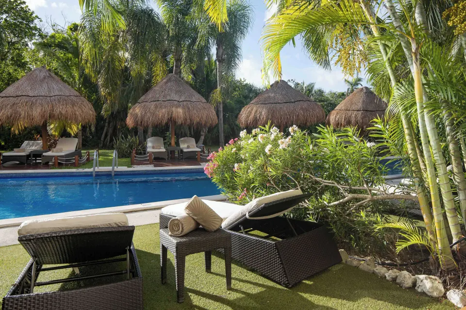Golden Swim Up Junior Suite loungers by the pool at Valentin Imperial Riviera Maya.
