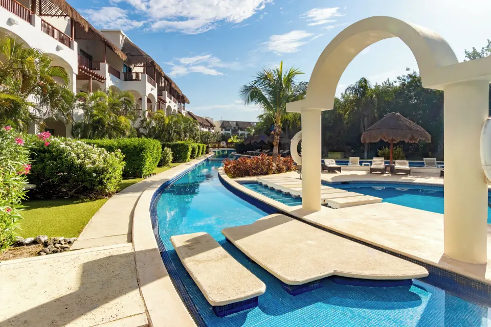 Golden Swim Up Junior Suite pool with arched entry at Valentin Imperial Riviera Maya.