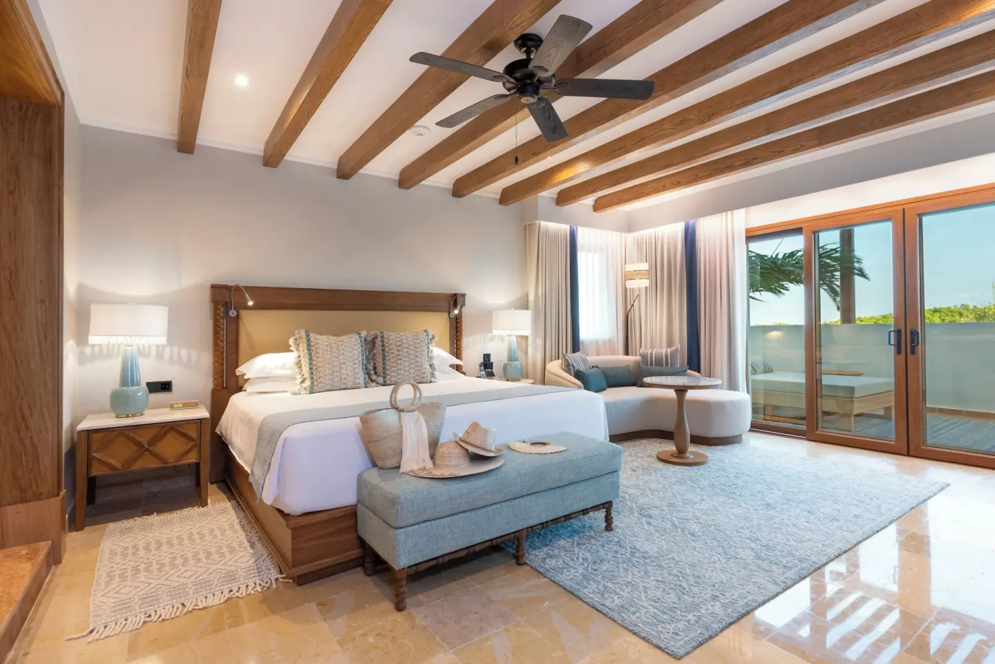 Suite Imperial Privé king bedroom with terrace doors at Valentin Imperial Riviera Maya.