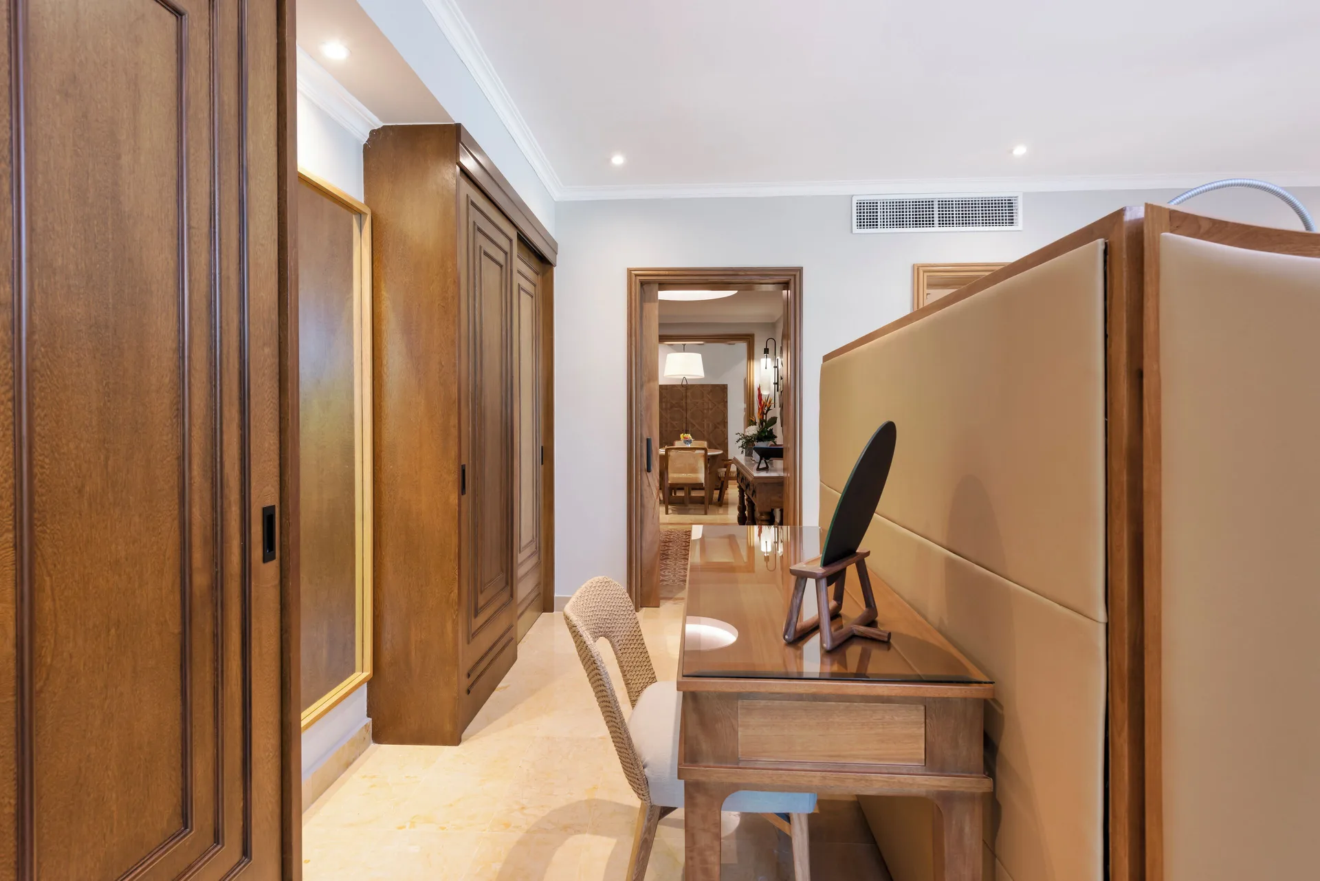 Onyx Honeymoon Suite desk, closets, and bedroom passage at Valentin Imperial Riviera Maya.