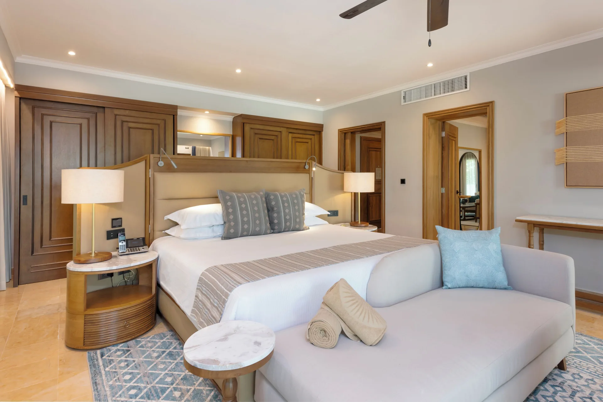 Onyx Honeymoon Suite king bed and sofa at Valentin Imperial Riviera Maya.