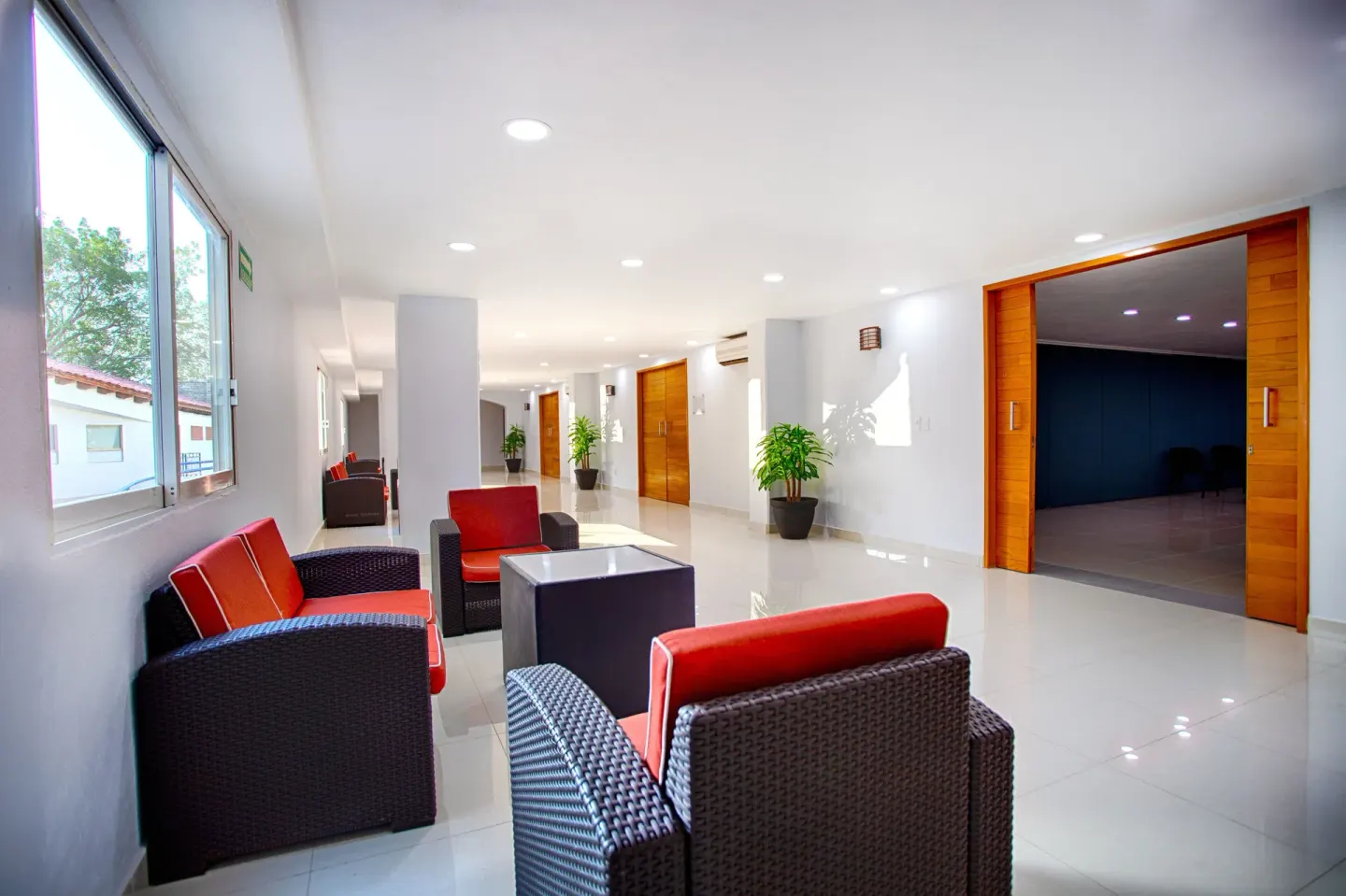 Lobby lounge seating in a bright hallway at Vamar Vallarta Marina and Beach Resort.