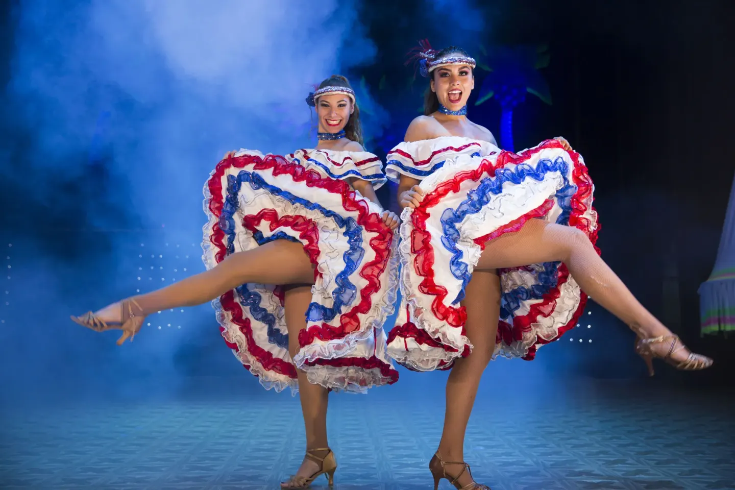 Two dancers performing on stage at Vamar Vallarta Marina and Beach Resort.